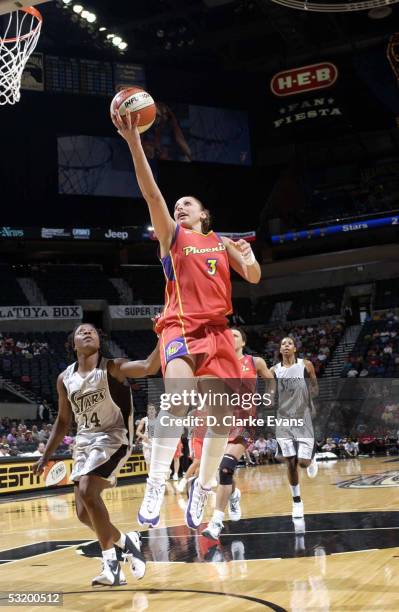 Diana Taurasi of the Phoenix Mercury shoots over Shannon Johnson of the San Antonio Silver Stars on July 5, 2005 at the SBC Center in San Antonio,...