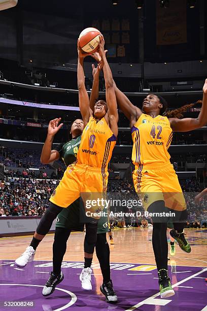 Alana Beard and Jantel Lavender of Los Angeles Sparks go for the rebound against Markeisha Gatling of Seattle Storm on May 15, 2016 at Staples Center...