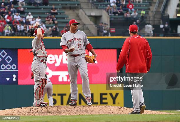 Manager Bryan Price of the Cincinnati Reds takes Alfredo Simon of the game in the fifth inning of the interleague game against the Cleveland Indians...