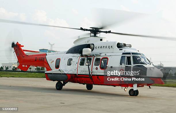 Super Puma AS332 L2 helicopter from the Hong Kong Government Flying Service arrives at the Shanghai Gaodong Airport on July 4, 2005 in Shanghai,...