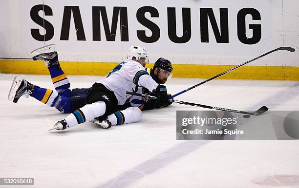 Joonas Donskoi of the San Jose Sharks and Patrik Berglund of the St. Louis Blues battle for the puck during the first period in Game Two of the...