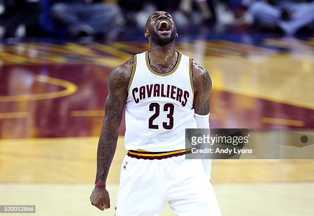LeBron James of the Cleveland Cavaliers reacts after a basket in the second quarter against the Toronto Raptors in game one of the Eastern Conference...