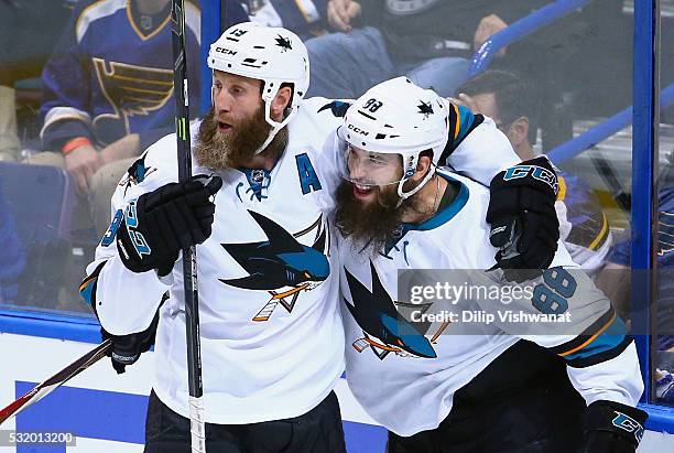 Brent Burns of the San Jose Sharks celebrates with Joe Thornton after scoring a second period goal against Brian Elliott of the St. Louis Blues in...