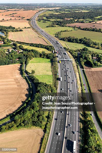 aerial view of the m25 motorway, england. - joas souza stock pictures, royalty-free photos & images