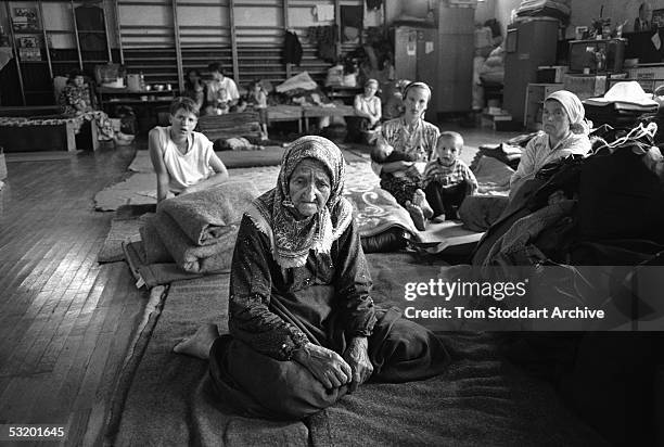 Srebrenica, BOSNIA An exhausted elderly woman pictured in a refugee centre set up to shelter Muslim families after they fled Srebrenica. In July 1995...