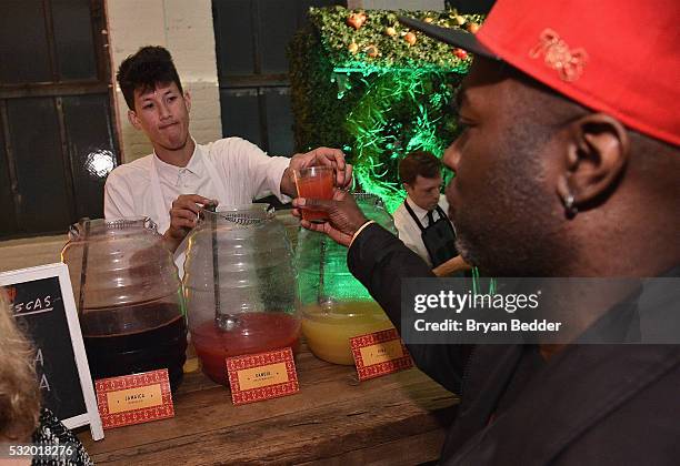 Guests drink aguas fresca as Casa Herradura visits New York City on May 17, 2016 in New York City.