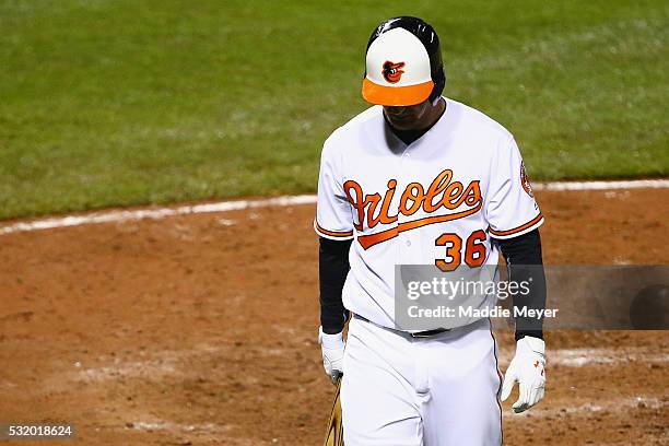 Caleb Joseph of the Baltimore Orioles reacts after striking out in the ninth inning against the Seattle Mariners on May 17, 2016 in Baltimore,...