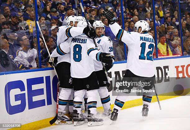 Brent Burns of the San Jose Sharks celebrates with Joe Thornton, Joe Pavelski, Logan Couture, and Patrick Marleau after scoring a second period goal...