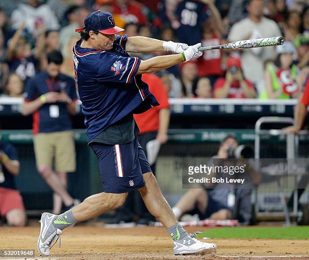 Brian Cushing of the Houston Texans celebrates with teammates after hitting a home run in the JJ Watt Charity Softball Classic at Minute Maid Park on...