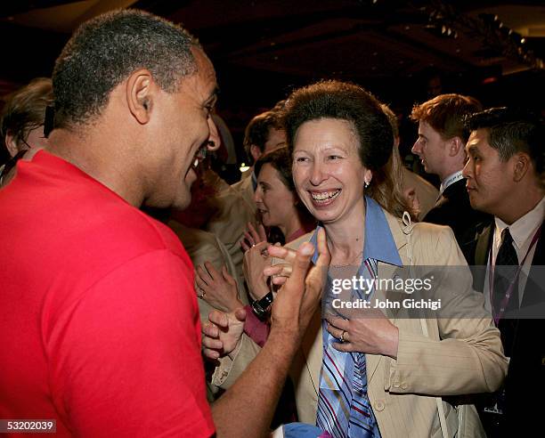 Daley Thompson celebrates with HRH The Princess Royal as London are voted to stage the 2012 Olympic Games at the Raffle City Convention Centre on...