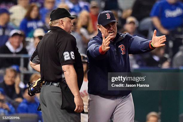 Manager John Farrell of the Boston Red Sox argues with home plate umpire Bill Miller after being ejected during the bottom of the seventh inning game...