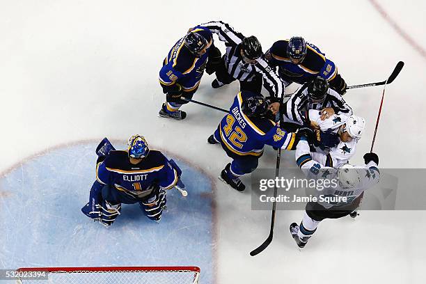 Joe Pavelski of the San Jose Sharks fights David Backes of the St. Louis Blues during the third period in Game Two of the Western Conference Final...