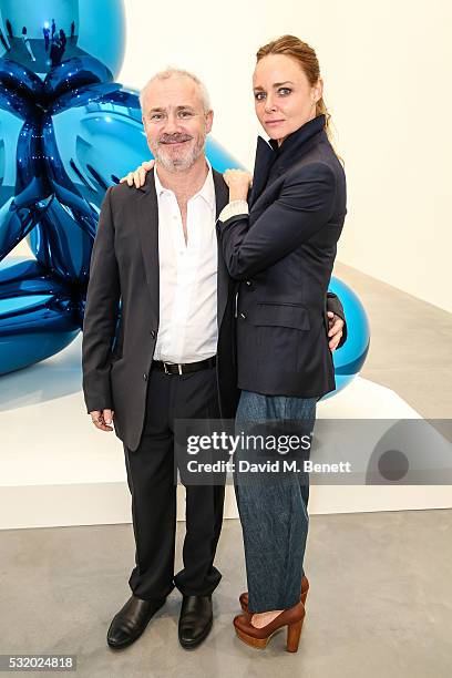 May 16: Damien Hirst and Stella McCartney attend a private dinner for Jeff Koons hosted by Damien Hirst at Newport Street Gallery on May 16, 2016 in...