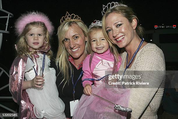 Host Amber Petty attends with her friend China Torr and her two daughters India and Little Charlie the opening night of Disney On Ice' "Princess...