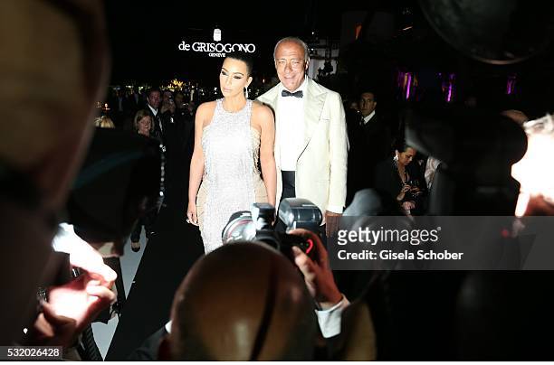 Kim Kardashian and host Fawaz Gruosi during the 'De Grisogono' Party at the annual 69th Cannes Film Festival at Hotel du Cap-Eden-Roc on May 17, 2016...