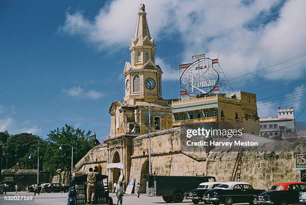 The Torre del Reloj, a main gateway into the city of Cartagena, Colombia, South America, with the Plaza de los Coches behind it, circa 1965.