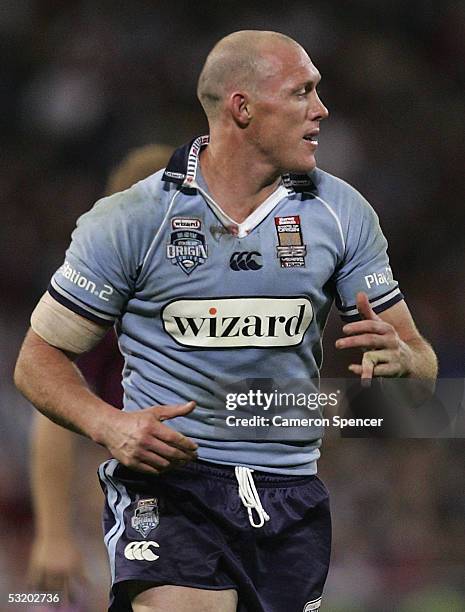 Craig Fitzgibbon of the Blues dislocates his finger during game three of the ARL State of Origin series between the Queensland Maroons and the New...