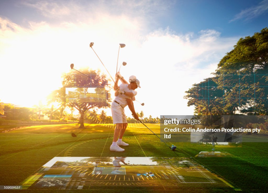 Multiple exposures of Caucasian golfer hitting ball on course surrounded by holograms