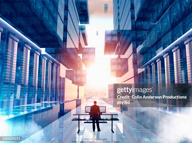 businessman using computer in virtual server room - better future stock pictures, royalty-free photos & images