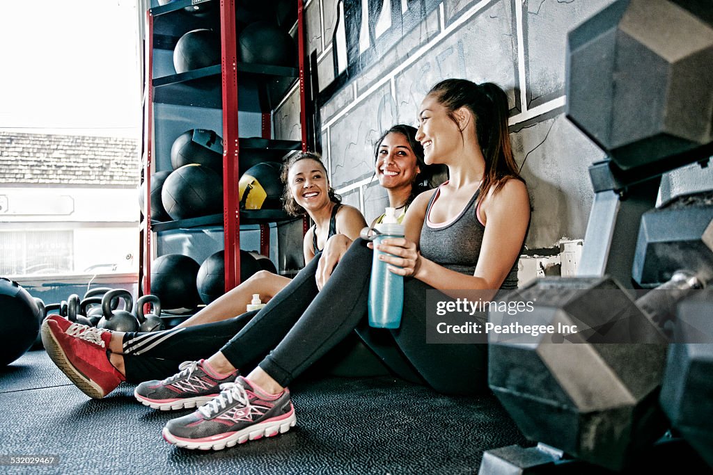 Women resting together in gym