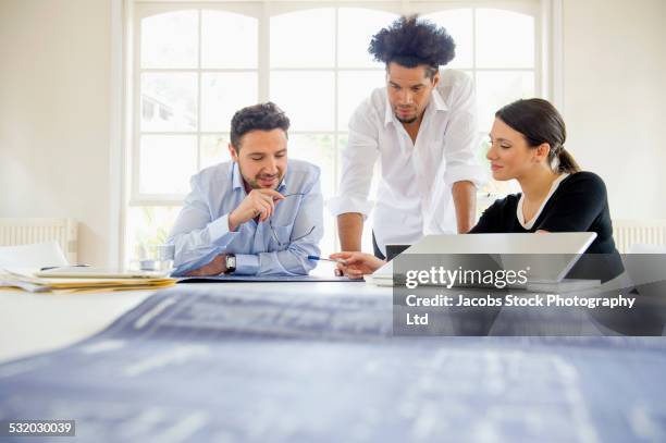 business people working together at conference table - melbourne city training session stock pictures, royalty-free photos & images