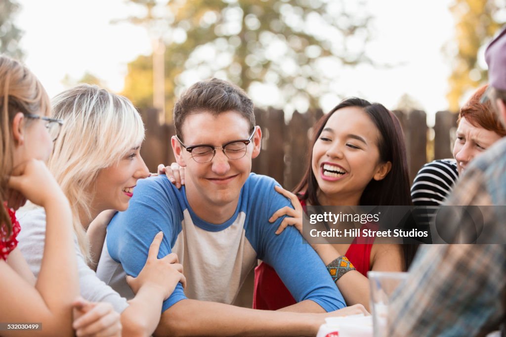 Friends talking at party