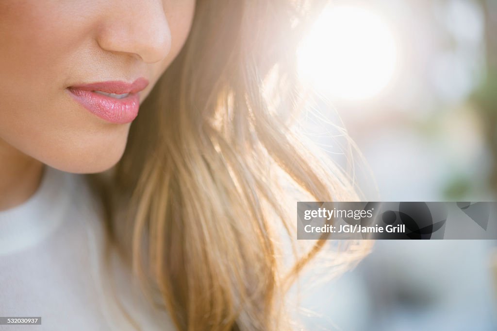 Close up of lips and hair of Hispanic woman