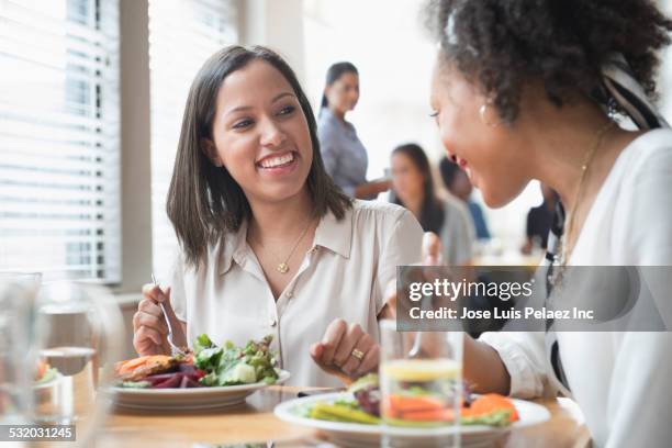 women eating lunch together in cafe - restaurant women friends lunch stock pictures, royalty-free photos & images