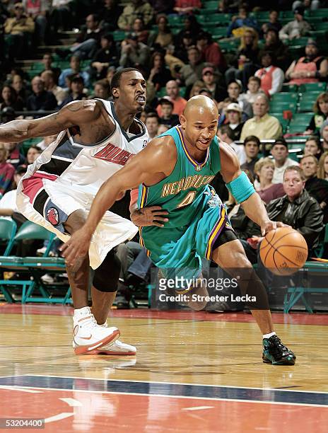 David Wesley of the New Orleans Hornets drives to the basket during the game against the Charlotte Bobcats on December 14, 2004 at the Charlotte...