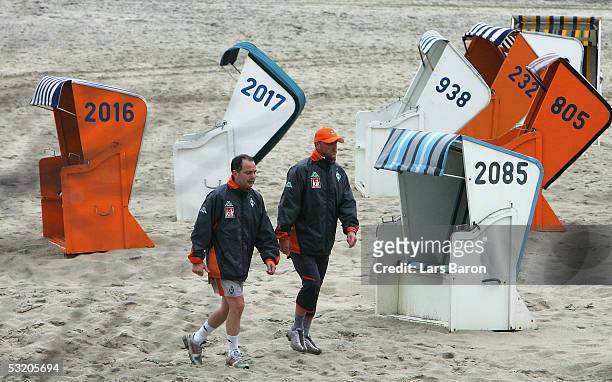 Doctor Goetz Dimanski and Coach Thomas Schaaf are seen during the training session of Werder Bremen training camp on July 7, 2005 at Norderney...
