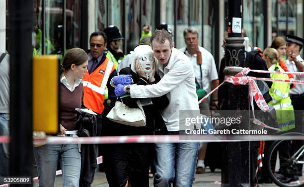 Emergency services assist evacuated passengers at Edgware Road following an explosion which has ripped through London's underground tube network on...