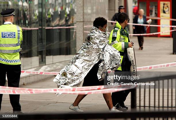 Emergency services assist evacuated passengers at Edgware Road station following a series of explosions which has ripped through London's underground...