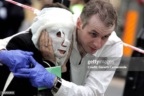 Paul Dadge helps Davinia Turrell to safety at Edgware Road station following a series of explosions which ripped through London's underground tube...