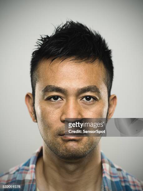 portrait of an angry young japanese man - mug shot stock pictures, royalty-free photos & images