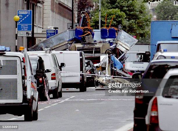 The remains of a bus are seen on Tavistock Square following a series of explosions which ripped through London's underground tube and bus network on...