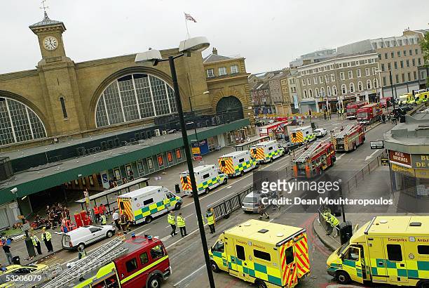 Emergency services are seen outside the main line station at Kings Cross following an explosion which has ripped through London's tube network on...