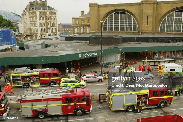 Emergency services are seen outside the main line station at Kings Cross following an explosion which has ripped through London's tube network on...