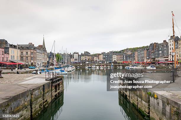 view on the harbour and the beautiful old houses of the town of honfleur, france. - joas souza ストックフォトと画像