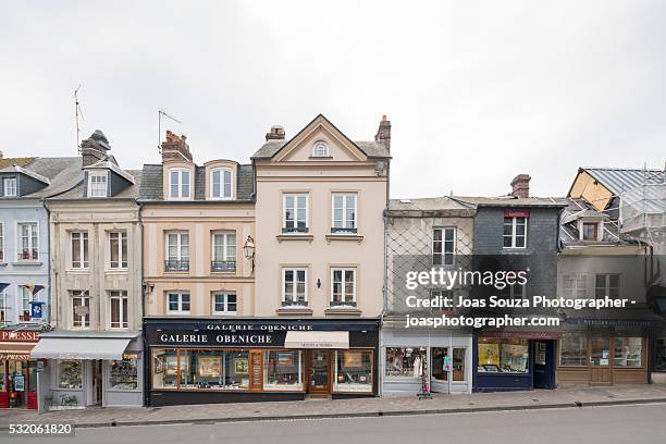 view of the shops and beautiful old houses of the town of honfleur, france. - calvados fotografías e imágenes de stock