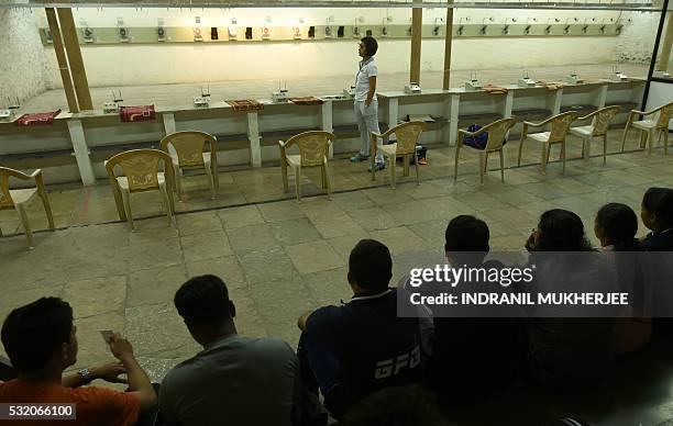 Shooting', INTERVIEW by Peter HUTCHISON In this photograph taken on April 25 Indian shooter Heena Sidhu takes part in a training session at the...