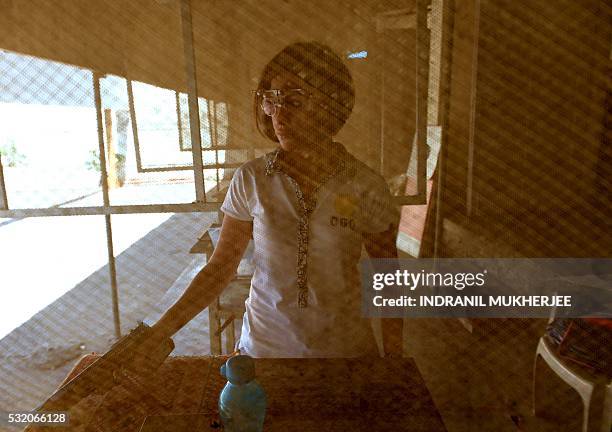 Shooting', INTERVIEW by Peter HUTCHISON In this photograph taken on April 25 Indian shooter Heena Sidhu prepares to take part in a training session...