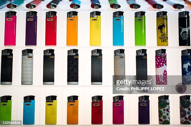 Picture taken on May 17, 2016 shows Bic lighters displayed at the company headquarters in Paris. At nearly 70 Bruno Bich will be re-nominated for two...