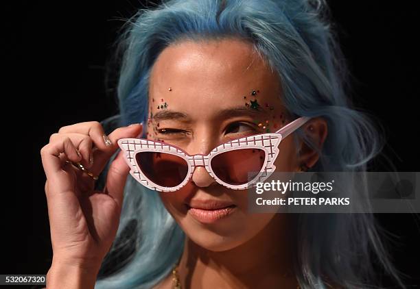 Model wears a creation from Australian designer Emma Mulholland during her show for Fashion Week Australia in Sydney on May 18, 2016. / AFP / PETER...
