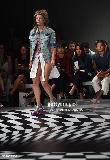 Model wears a creation from Australian designer Emma Mulholland during her show for Fashion Week Australia in Sydney on May 18, 2016. / AFP / PETER...