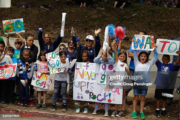 Grade schoolers cheer on the peloton as the race during stage three of the 2016 Amgen Tour of California from Thousand Oaks to Santa Barbara on May...