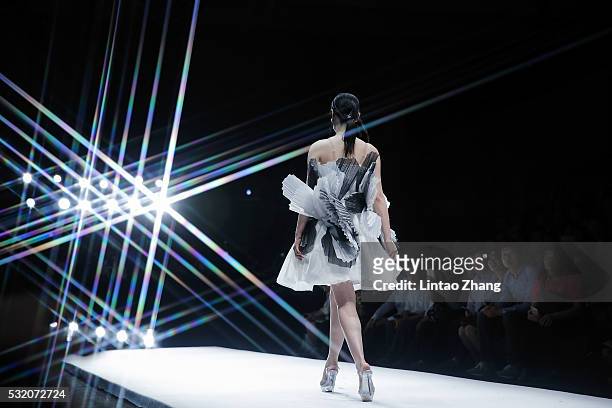 Model showcases designs on the runway at Guangzhou Nanyang Polytechnic Graduate Show during the day four of China Graduate Fashion Week at the 751...