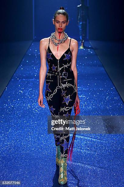 Model walks the runway during the Di$count Universe show at Mercedes-Benz Fashion Week Resort 17 Collections at Carriageworks on May 18, 2016 in...