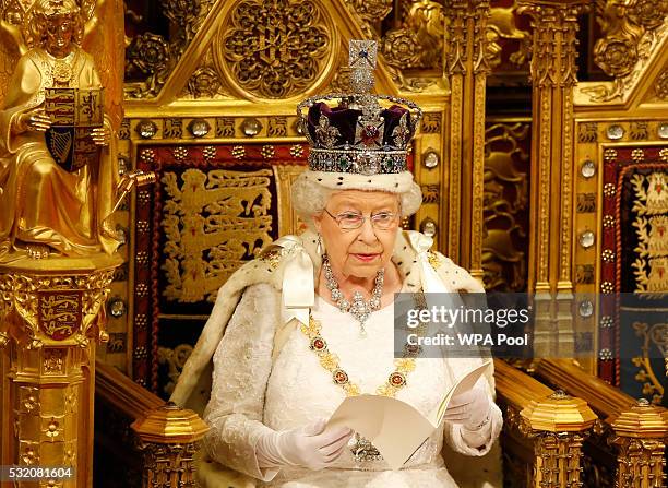 Queen Elizabeth II reads the Queen's Speech from the throne during State Opening of Parliament in the House of Lords at the Palace of Westminster on...