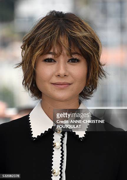 Japanese actress Maki Yoko smiles on May 18, 2016 during a photocall for the film "After the Storm " at the 69th Cannes Film Festival in Cannes,...
