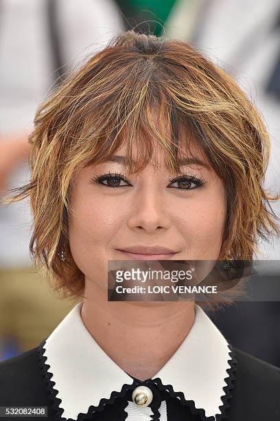 Japanese actress Maki Yoko poses on May 18, 2016 during a photocall for the film "After the Storm " at the 69th Cannes Film Festival in Cannes,...